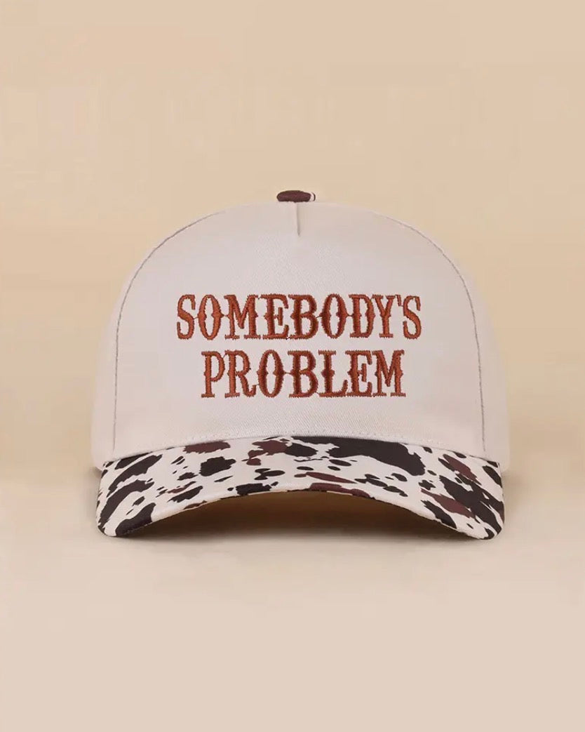 Z1B-U769COW Somebody’s Problem embroidered Tab Embroidered Trucker Cap