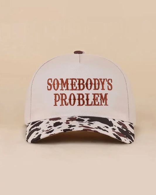 Z1B-U769COW Somebody’s Problem embroidered Tab Embroidered Trucker Cap